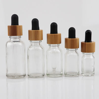 100ml καλλυντικό μπουκάλι γυαλιού ουσιαστικού πετρελαίου με dropper μπαμπού το δέρμα προσοχής καφετί